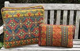 Celtic Knot and Mediasch needlepoint kits in red, gold, green, and blue colors