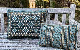 Celtic Knot and Balouch needlepoint kits in sage, teal, dark accent colors 