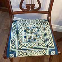 Lindisfarne needlepoint upholstery on chair seat